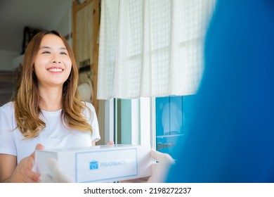 Sick Asian Woman Hand Hold For Receive Medication First Aid Pharmacy Box From Hospital Delivery Service At Front Home, Merchandise Medicine, Delivery Man Give Medicine Drug Store To Patient Female