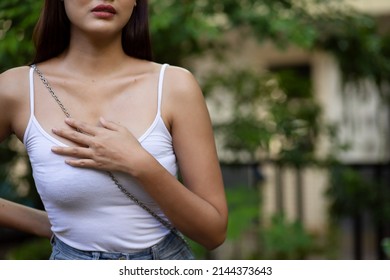 Sick Asian Woman Having Breast Related Disease, Acid Reflux, Sore Throat Or Pharynx Allergy