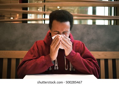 Sick Black Man In Cafe