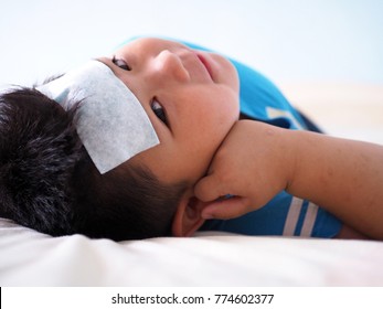 Sick Boy With Cool Gel Fever On Head.   