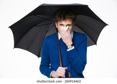 Sick Business Man Holding Umbrella And Blowing Nose