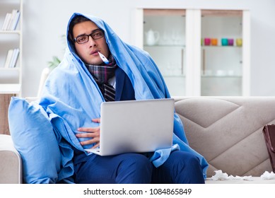 Sick Businessman Working From Home Due To Flu Sickness