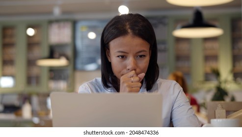 Sick Businesswoman Cough Working On Laptop In Cafe. Portrait Of African Woman Feeling Unwell And Sneezing Sitting In Restaurant With Computer