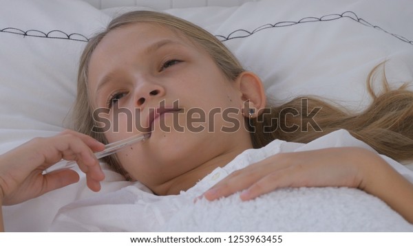 kid with thermometer