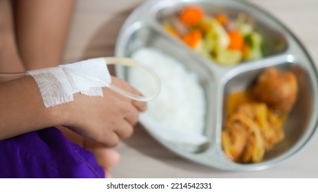 Sick Child With Parenteral Nutrition Eating Hospital Food