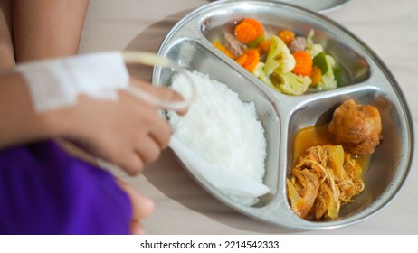 Sick Child With Parenteral Nutrition Eating Hospital Food