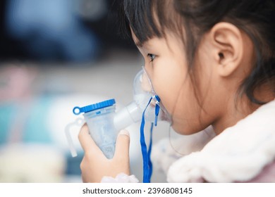 A sick child with pneumonia is undergoing nebulization