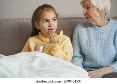 Sick Child Taking Medication To Feel Better