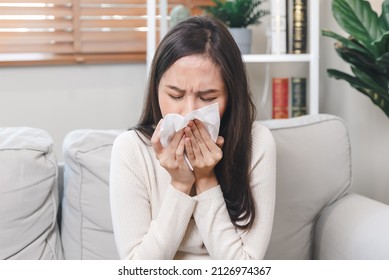 Sick day at home. Asian woman has runny and common cold. - Shutterstock ID 2126974367