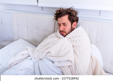 Sick Day At Home. Handsome Man Has Fever And Common Cold. Cough. Closeup Of Young Man Caught Cold Or Flu Illness. Portrait Of Unhealthy Man Feeling Pain In Throat.