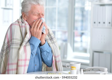 Sick elderly man with pills - Powered by Shutterstock