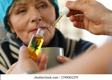 Sick Elderly Woman At Home Takes Drops Cannabis Cup. Side Effects Drugs. Cold Medicine For Elderly. Weak Immune System In Old Age. Use The Drug In Therapeutic Doses. Danger To Elderly