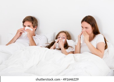 Sick Family In Bed