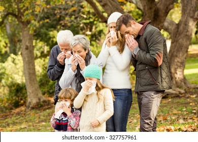 Sick Family Blowing Their Noses On An Autumns Day