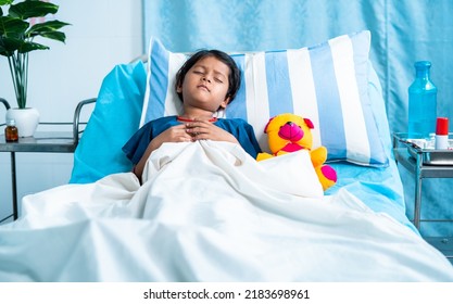 Sick Girl Child With Teddy Bear Sleeping On Bed At Hospital - Concept Of Medial Treatment, Illness And Childcare.