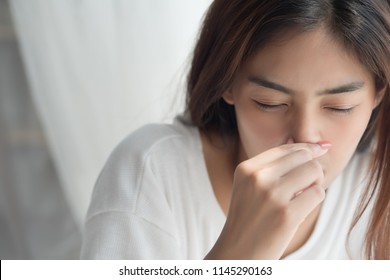 Sick Girl Sniffle With Runny Nose; Sick Woman Suffering From Cold, Flu, Runny Nose, Trying To Clear Her Nose; Woman Personal Health Care, Pain, Sickness Concept; Asian Young Adult Woman Model