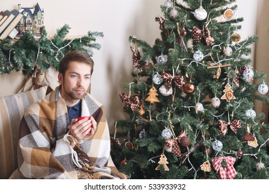 Sick Guy Isolated Has Runny Nose. Man Makes A Cure For The Common Cold. Winter Concept - Christmas Holiday. The Disease Is Not Just  Warm Blanket