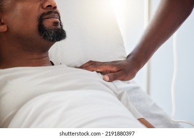 Sick, ICU Or Ill Man Lying On A Hospital Bed With Support And Care From A Person Inside. Closeup Of An African American Male Patient Getting Medical Treatment Or Aid For An Emergency Or Cancer