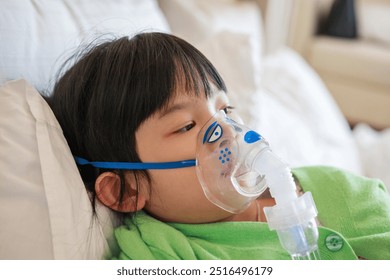 Sick little asian girl inhalation with nebulizer for respiratory treatment - Powered by Shutterstock