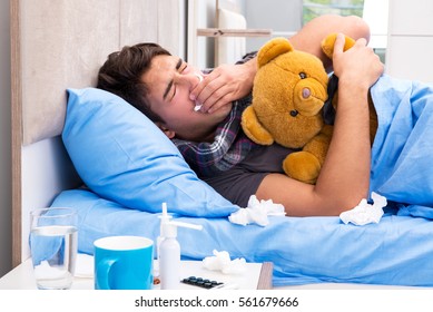 Sick Man With Flu Lying In The Bed