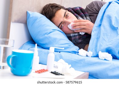 Sick Man With Flu Lying In The Bed