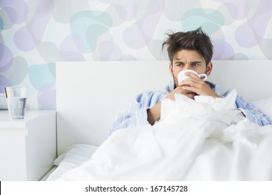 Sick Man Having Coffee In Bed