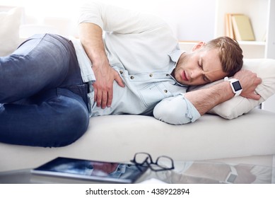 Sick Man Lying On The Couch