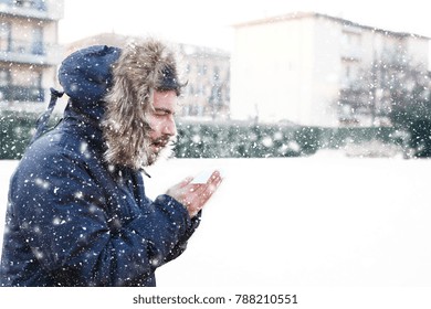 Sick Man Sneezing In The Kleenex In Winter