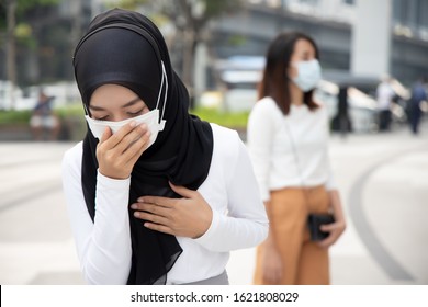 Sick Muslim Woman Wearing Mask With Dirty Polluted Smog; Concept Of Epidemic Outbreak, Dirty Air, Air Pollution, Allergy Sickness, Breathing Difficulty, Sore Throat, Lung Cancer, Bad Air Quality