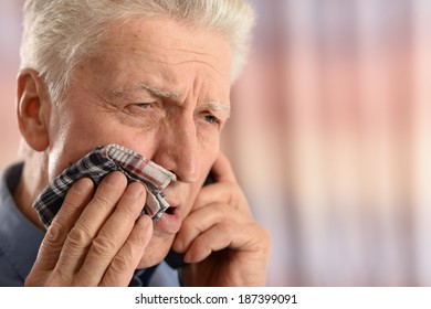 Sick Old Man With Tooth Pain Standing On Colored Background