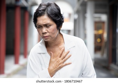 Sick Old Senior Woman Suffering From GERD Or Acid Reflux