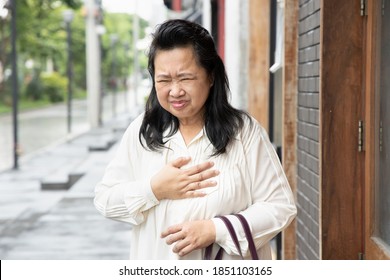 Sick Old Senior Woman Suffering From GERD Or Acid Reflux