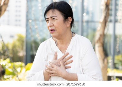 Sick Old Senior Woman Suffering From GERD Or Acid Reflux