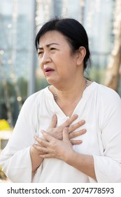 Sick Old Senior Woman Suffering From GERD Or Acid Reflux