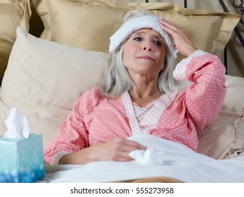 Sick Older Woman Laying In Bed