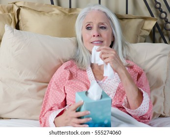 Sick Older Woman Laying In Bed