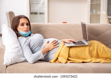Sick pregnant woman suffering at home  - Shutterstock ID 1395273422