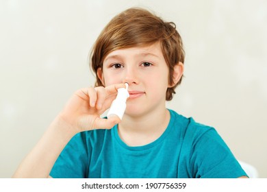 Sick School Boy With Runny Nose Using Nasal Medicine Spray. Nasal Allergy. Kid With Ill Disease Treatment Season. Allergic Kid, Flu Season. Boy Has A Virus, Runny Nose And Headache.