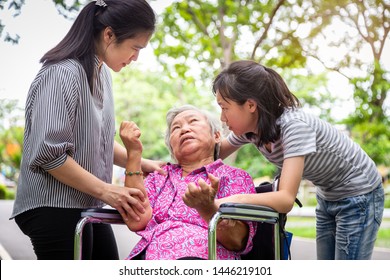 Sick Senior Grandmother With Epileptic Seizures In Outdoor,elderly Patient Convulsions Suffering From Illness With Epilepsy During Seizure Attack,asian Daughter,granddaughter Cry,family Care Concept