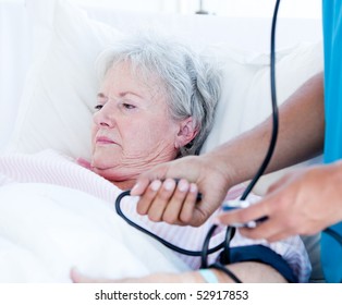 Sick Senior Woman Lying On A Hospital Bed. Medical Concept.