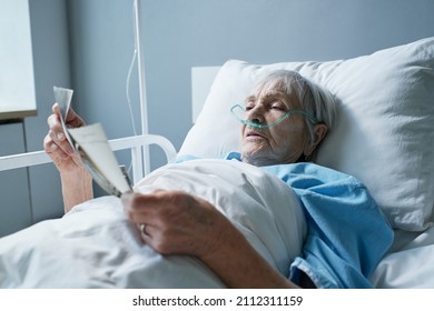 Sick senior woman remembering her past moments - Powered by Shutterstock