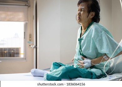 Sick Senior Woman Suffering From Appendicitis,severe Abdominal Pain,female Patient With A Stomach Ache Sit In A Hospital Bed,problems With Liver Disease Or Irritable Bowel Syndrome,colorectal Cancer