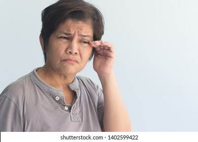 Sick Senior Woman Suffering From Dry Eye, Eye Irritation Or Inflammation