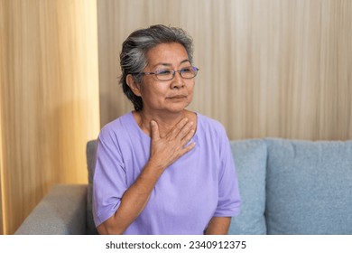 Sick senior women touching neck unwell coughing with sore throat pain,lung cancer,bronchitis,Bronchial Asthma,Tuberculosis,pneumonia,covid-19,eco air pollution pm2.5.insurance and hospital - Powered by Shutterstock