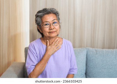 Sick senior women touching neck unwell coughing with sore throat pain,lung cancer,bronchitis,Bronchial Asthma,Tuberculosis,pneumonia,covid-19,eco air pollution pm2.5.insurance and hospital	 - Powered by Shutterstock