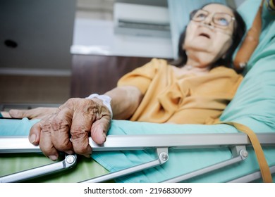 Sick Southeast Asian female senior patient with respiratory disorder having bedrest in hospital - Shutterstock ID 2196830099