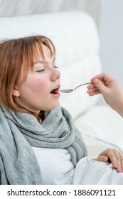 Sick Teen Girl Take Medication Pouring In A Spoon From Mom