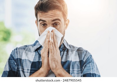 Sick, tissue and portrait of man blowing nose in city for health, wellness and relief for congestion. Male person, illness and outside in spring with allergies, virus infection and reaction to pollen - Powered by Shutterstock