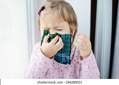 Sick Toddler Girl With Handkerchief At The Home