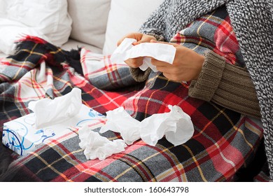 Sick Woman Blowing Her Nose With Tissues